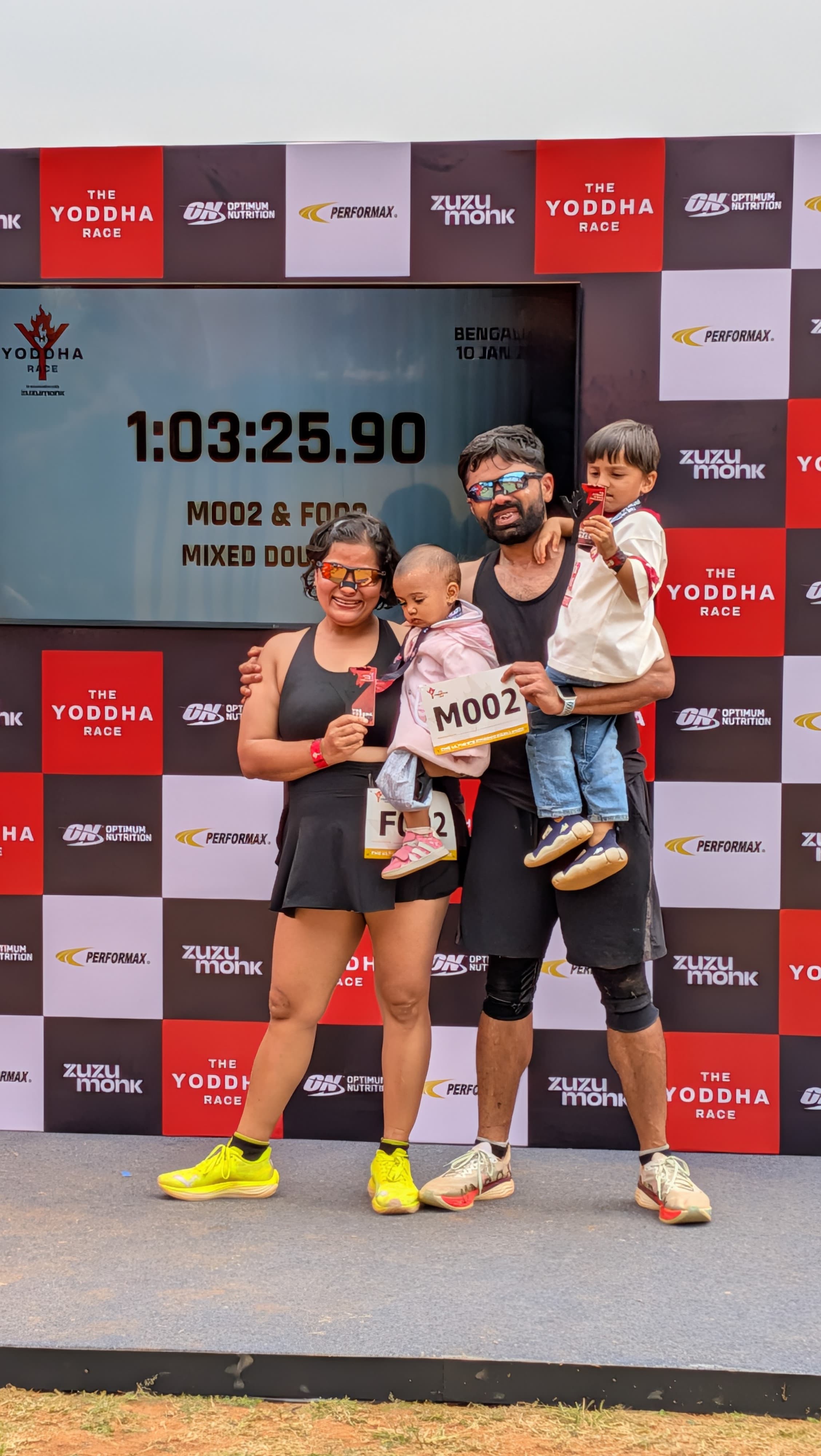 Naman, Shubhangini, and the kids at the Yoddha Mixed Doubles finish — 1:03:25